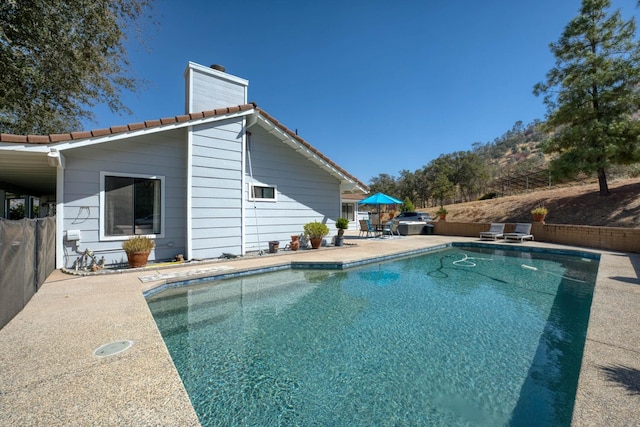 view of pool featuring a patio