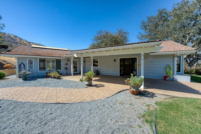 ranch-style house featuring a patio