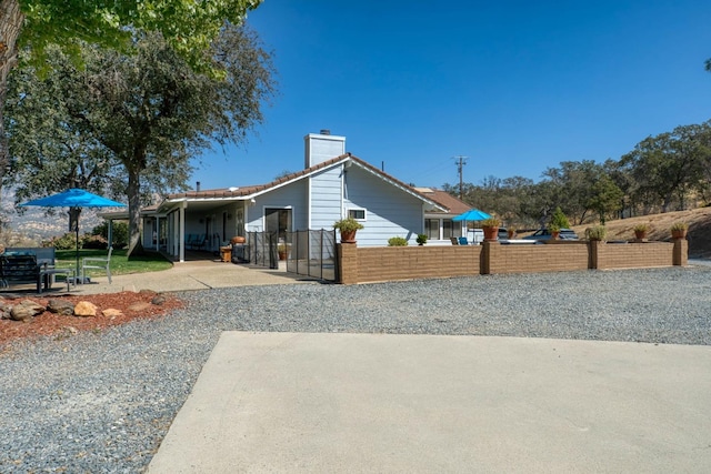 exterior space featuring a carport