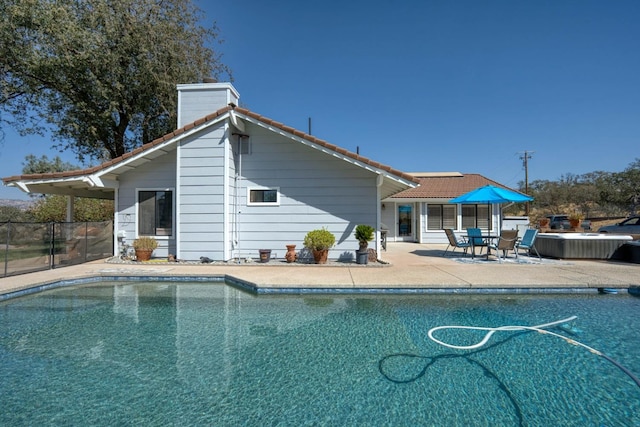 view of swimming pool with a patio area