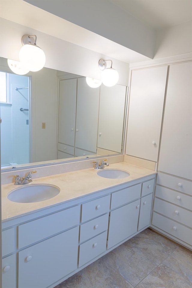 full bath featuring double vanity and a sink