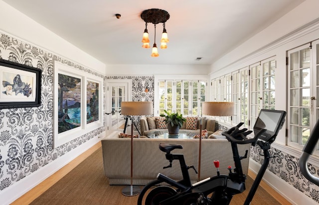 9486 E Lincoln Ave, Del Rey, CA 93616 - exercise area featuring wood finished floors, wallpapered walls, french doors, and baseboards