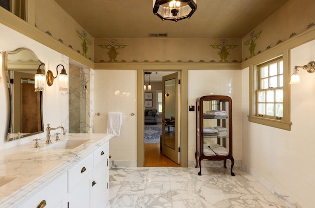 9486 E Lincoln Ave, Del Rey, CA 93616 - ensuite bathroom with a sink, ensuite bathroom, marble finish floor, double vanity, and visible vents