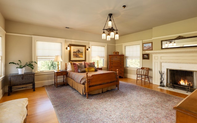 9486 E Lincoln Ave, Del Rey, CA 93616 - bedroom with wood finished floors, visible vents, and multiple windows