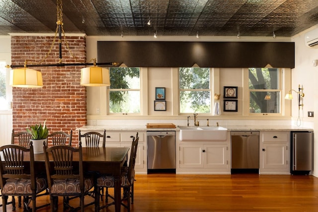 9486 E Lincoln Ave, Del Rey, CA 93616 - kitchen featuring wood finished floors, a sink, appliances with stainless steel finishes, and an ornate ceiling