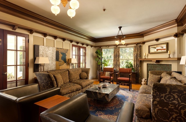 9486 E Lincoln Ave, Del Rey, CA 93616 - living room featuring wood finished floors, a notable chandelier, and crown molding