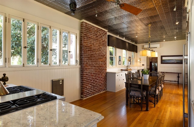 9486 E Lincoln Ave, Del Rey, CA 93616 - interior space with a wealth of natural light, an ornate ceiling, a wall unit AC, and light wood-type flooring