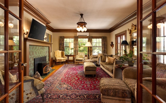 9486 E Lincoln Ave, Del Rey, CA 93616 - sitting room with wood finished floors, an AC wall unit, an inviting chandelier, and ornamental molding