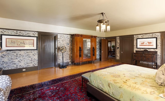 9486 E Lincoln Ave, Del Rey, CA 93616 - bedroom featuring wood finished floors and wallpapered walls