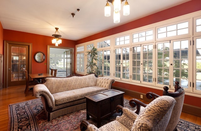 9486 E Lincoln Ave, Del Rey, CA 93616 - sunroom featuring french doors, wood finished floors, and an inviting chandelier