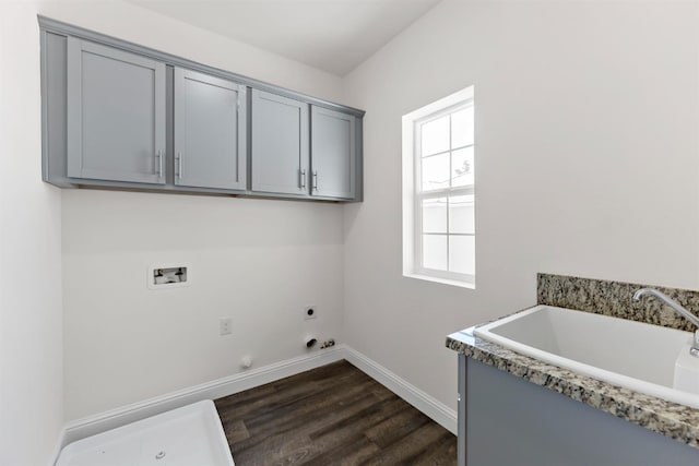 laundry area with cabinets, hookup for an electric dryer, dark hardwood / wood-style floors, hookup for a gas dryer, and hookup for a washing machine