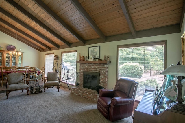 carpeted living room with wood ceiling, a wealth of natural light, beam ceiling, and a brick fireplace