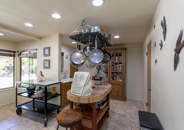 dining space with a notable chandelier and sink