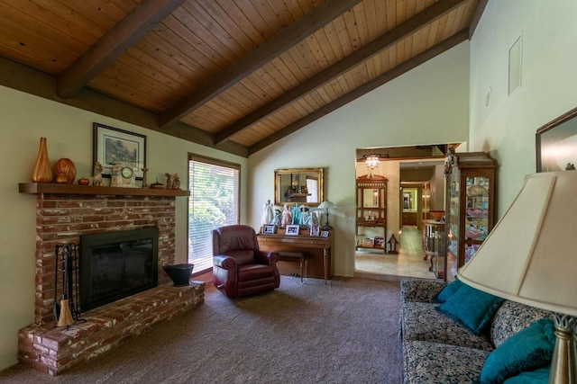 carpeted living room with beamed ceiling, a fireplace, high vaulted ceiling, and wooden ceiling