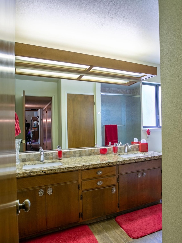 bathroom featuring hardwood / wood-style floors and vanity