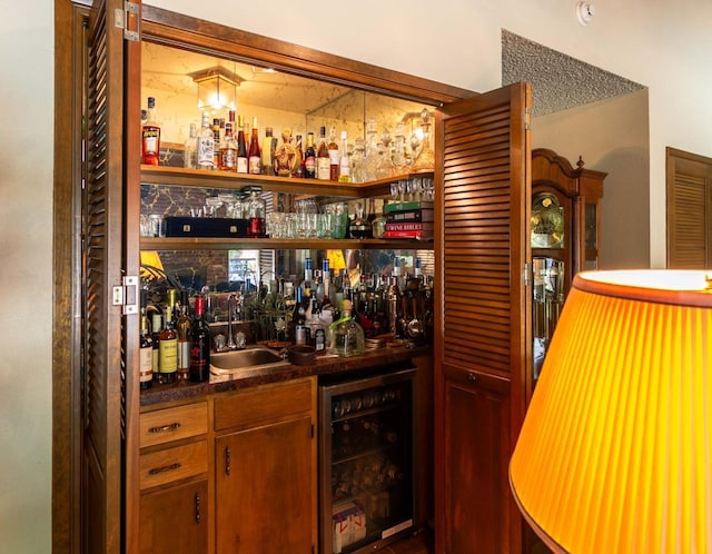 bar featuring sink and wine cooler