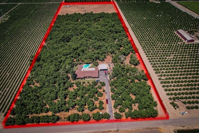 birds eye view of property with a rural view