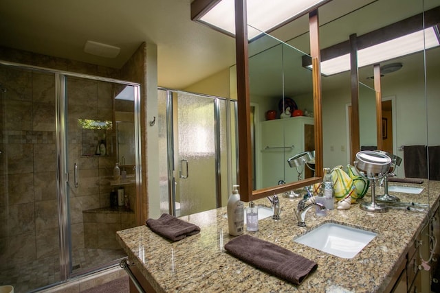 bathroom with vanity and an enclosed shower