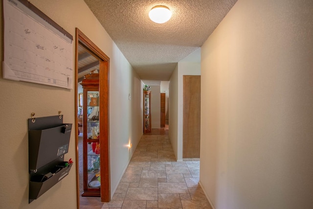 corridor with a textured ceiling