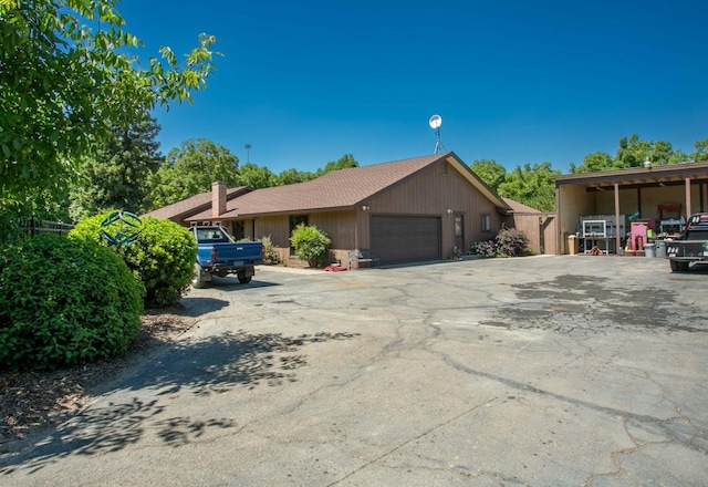 single story home featuring a garage