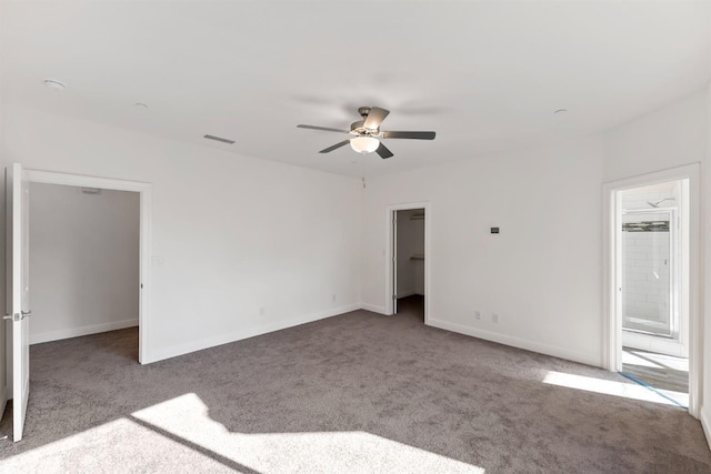 unfurnished room with ceiling fan and light carpet