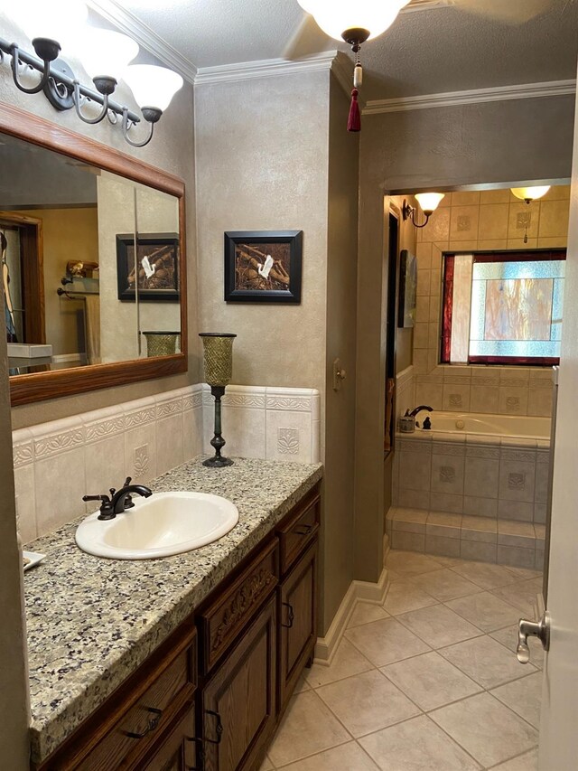 bathroom featuring tiled bath, crown molding, tasteful backsplash, vanity, and tile patterned flooring