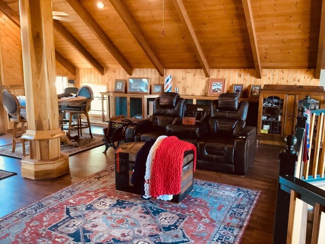 living room featuring wooden walls, wood finished floors, wooden ceiling, and lofted ceiling with beams
