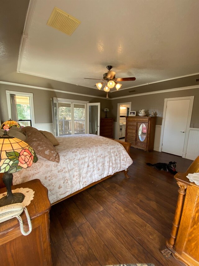 bedroom featuring wainscoting, visible vents, access to outside, ornamental molding, and wood-type flooring