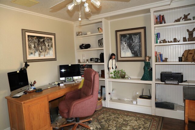 office featuring wood finished floors, ceiling fan, built in features, ornamental molding, and visible vents