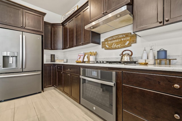 kitchen featuring dark brown cabinets and stainless steel appliances