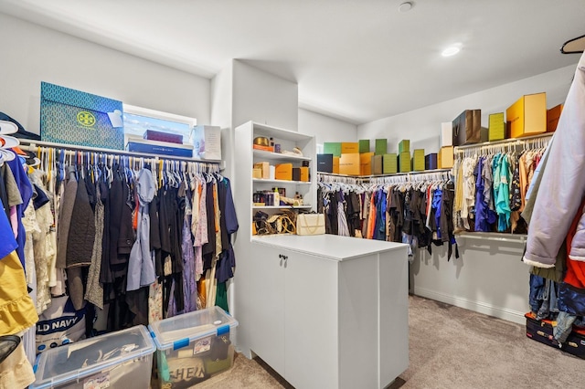 spacious closet featuring light carpet