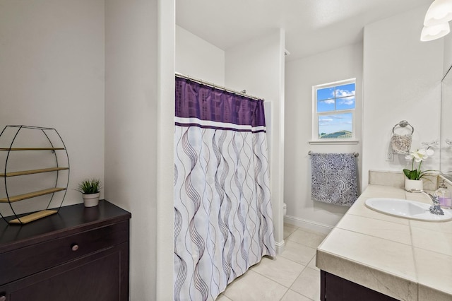 bathroom with tile patterned floors, vanity, and toilet