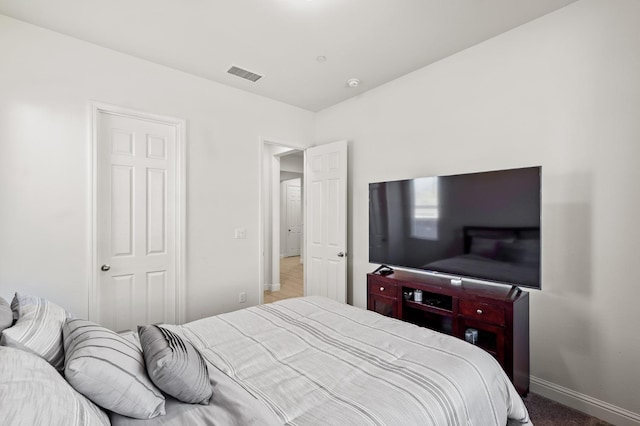 bedroom with carpet floors and a closet