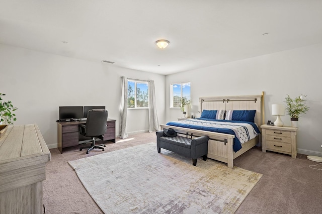 bedroom with light carpet