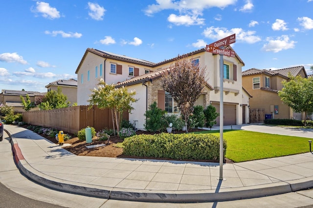 mediterranean / spanish-style house with a garage