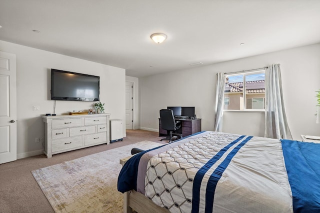 bedroom featuring light carpet