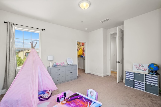 bedroom featuring light carpet