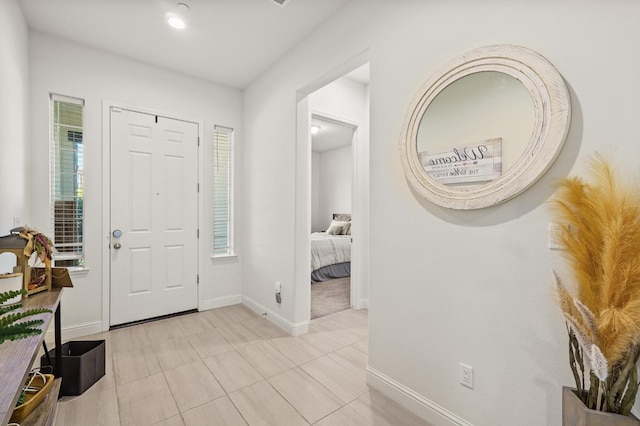 entrance foyer featuring light tile patterned flooring