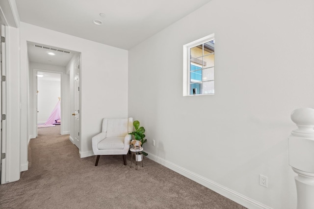 sitting room with light carpet