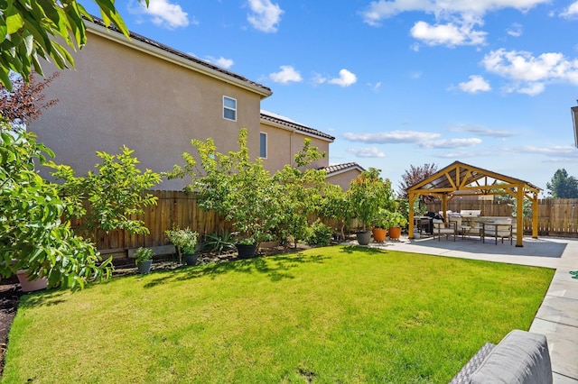 view of yard featuring a gazebo and a patio area