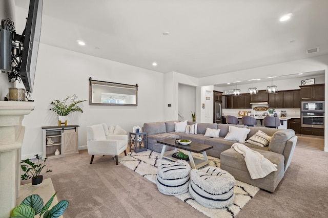 living room featuring light carpet