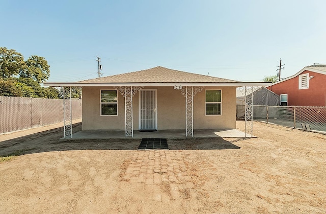 view of front of property featuring a patio