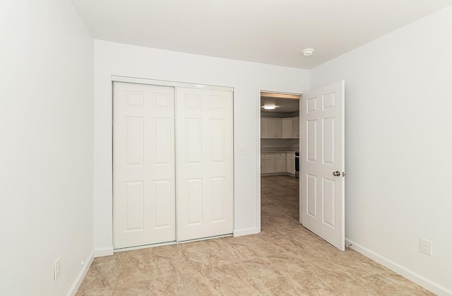 unfurnished bedroom featuring a closet