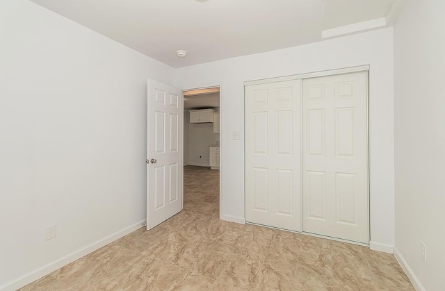 unfurnished bedroom featuring a closet