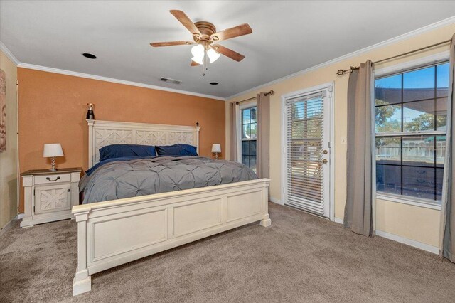 carpeted bedroom featuring access to outside, ceiling fan, and crown molding