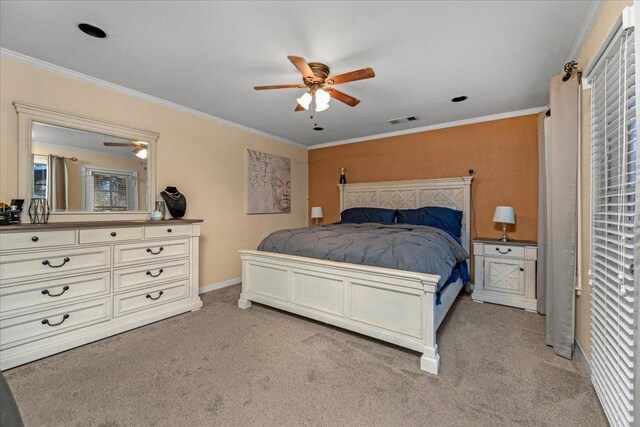 carpeted bedroom featuring ceiling fan and ornamental molding