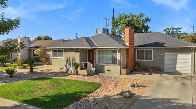 single story home featuring a garage and a front yard