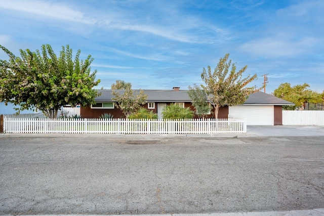 single story home with a garage