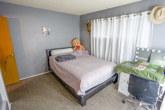 carpeted bedroom with a textured ceiling