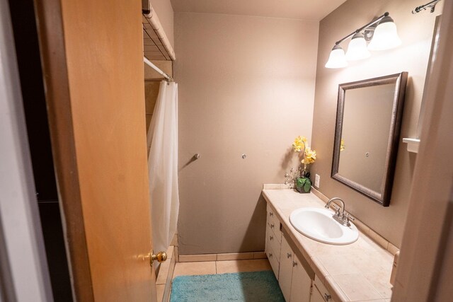 bathroom with vanity, shower / tub combo, and tile patterned flooring